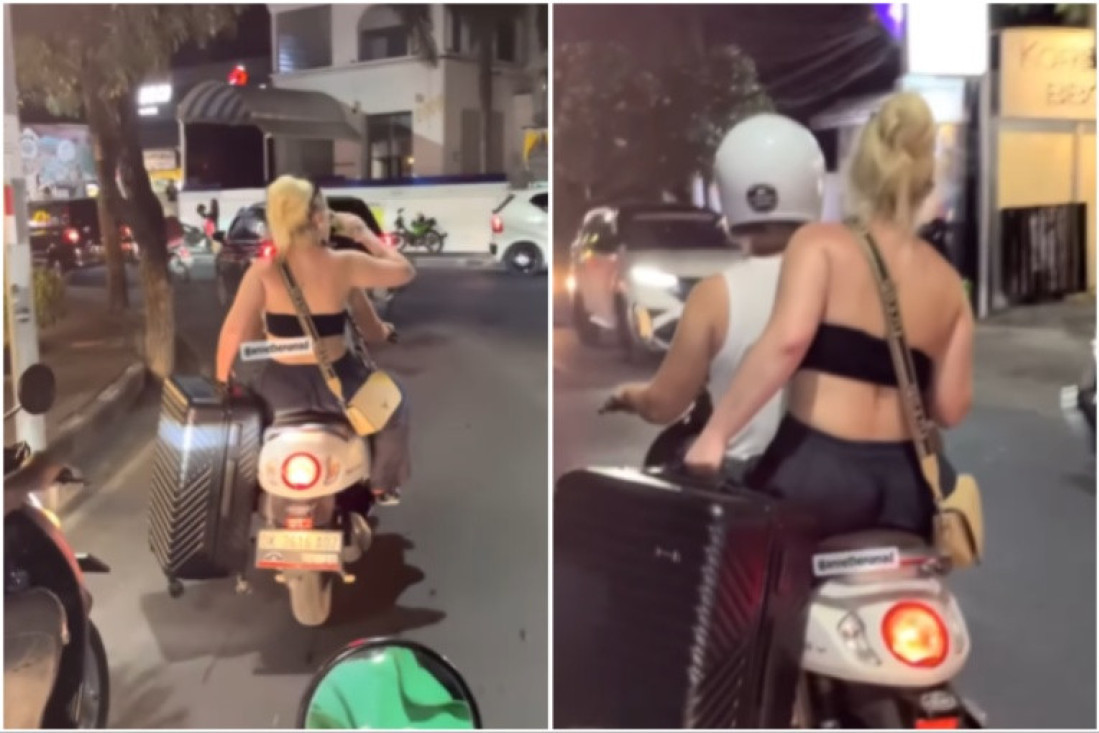 U jednoj ruci kofer, u drugoj piće: Ovako se jedna devojka vozila na motoru, mnoge je razbesnela (VIDEO)